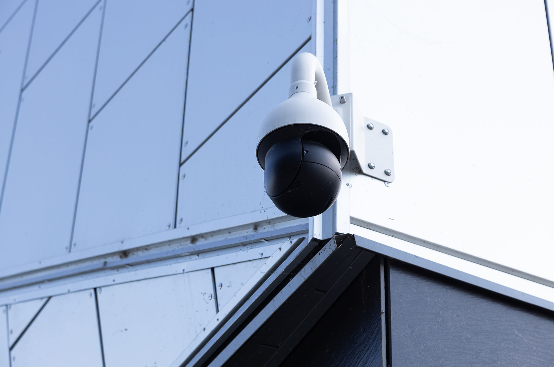 close-up-of-modern-video-monitoring-camera-on-whit-2023-01-13-02-51-56-utc.jpg